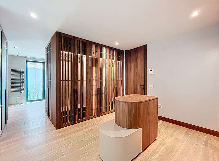 Step into luxury with this stunning property featuring exquisite wooden accents and a modern design.