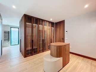 Step into luxury with this stunning property featuring exquisite wooden accents and a modern design.