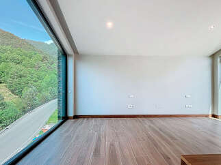 Discover a stunning property with breathtaking views of lush green mountains.