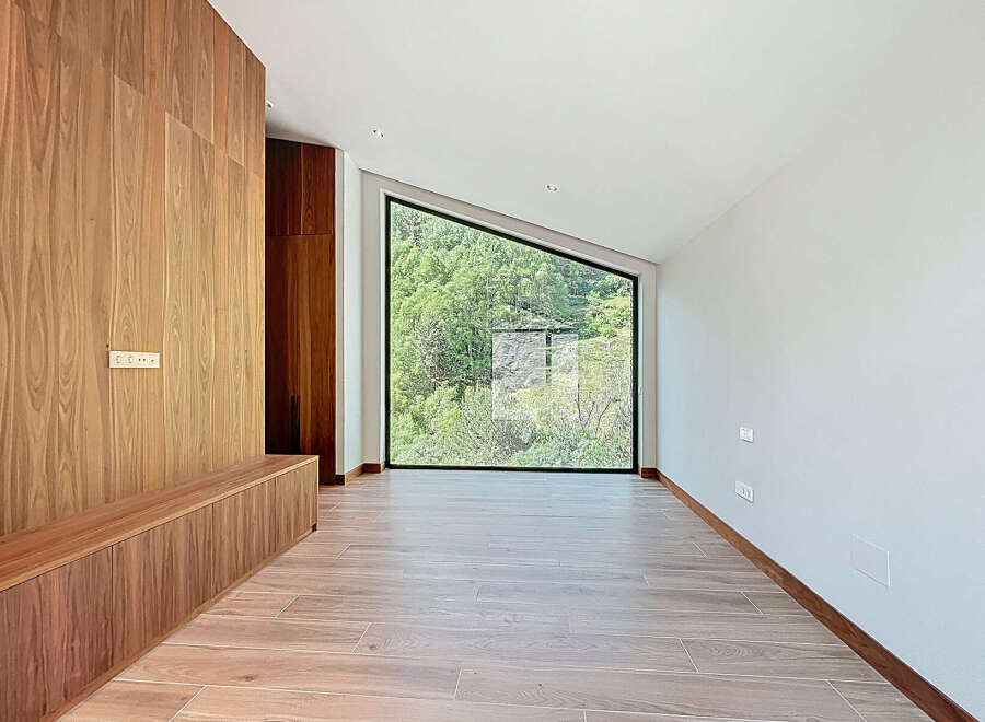 This stunning property boasts a unique architectural design with a modern interior.