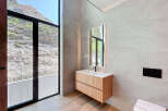 Experience luxury in this stunning bathroom with breathtaking mountain views.