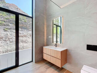 Experience luxury in this stunning bathroom with breathtaking mountain views.
