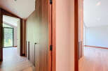 Discover the elegance of this modern property, featuring stunning wooden accents and a seamless design.
