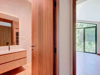 Step into a beautifully designed bathroom with a modern vanity and a sleek mirror.