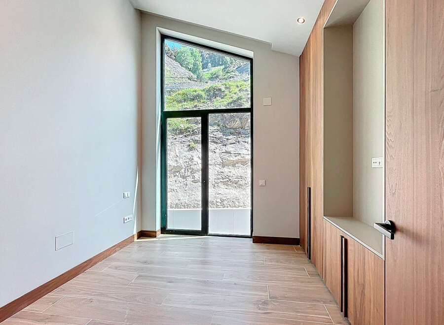 Discover a modern interior with a unique window design.