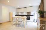 This modern kitchen offers a sleek and functional space, perfect for culinary enthusiasts.