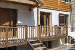 Discover the charm of this stunning property, featuring a beautifully crafted wooden deck and inviting entrance.