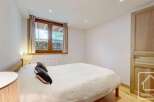 This cozy bedroom features a comfortable bed, perfect for a relaxing retreat.
