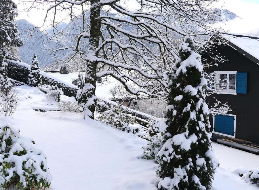 Nestled in a serene winter wonderland, this charming property boasts a picturesque setting.