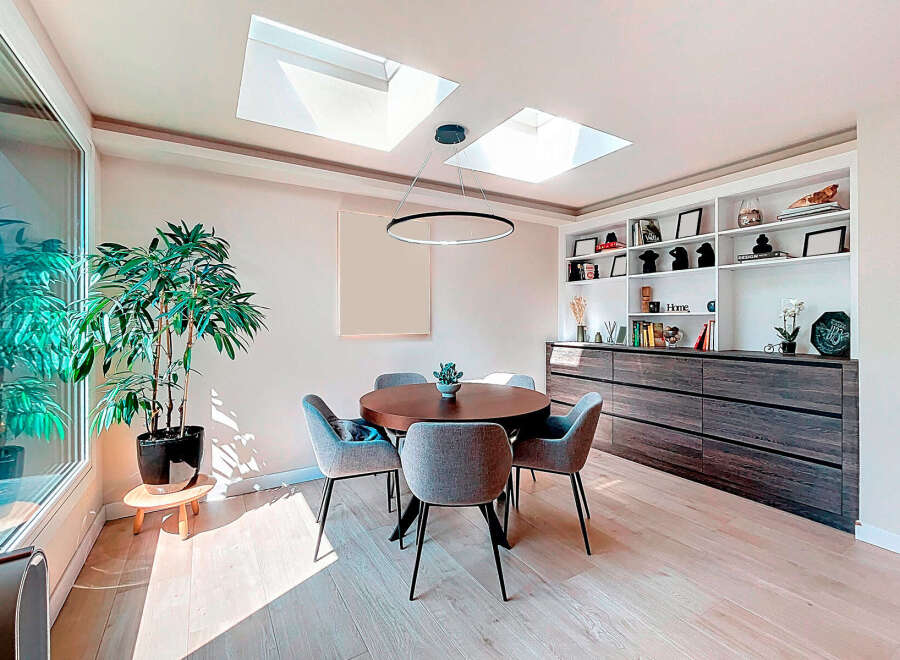 This stunning dining room boasts a modern design with a touch of elegance.