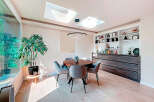 This stunning dining room boasts a modern design with a touch of elegance.