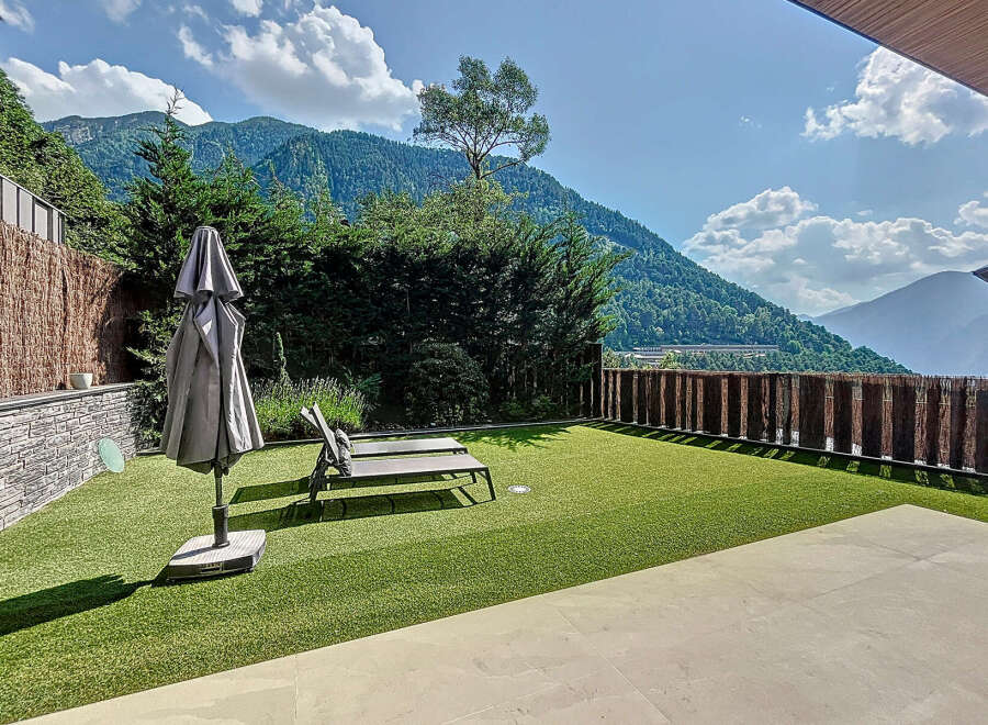 Enjoy breathtaking mountain views from this luxurious outdoor space.