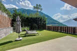 Enjoy breathtaking mountain views from this luxurious outdoor space.