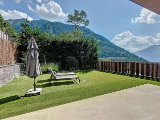 Enjoy breathtaking mountain views from this luxurious outdoor space.