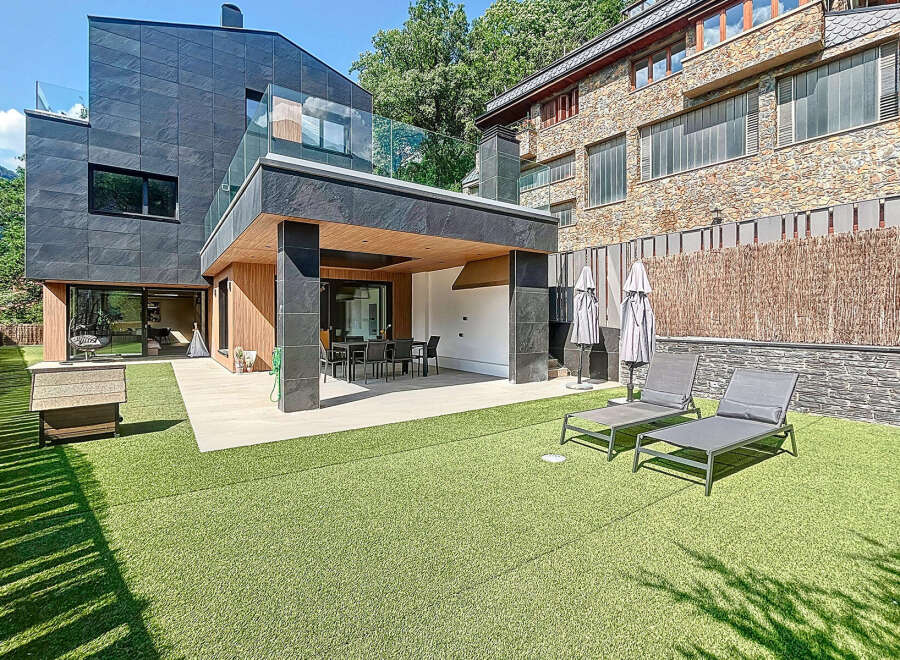 Discover modern luxury in this stunning property featuring sleek architecture and a beautifully landscaped outdoor space.