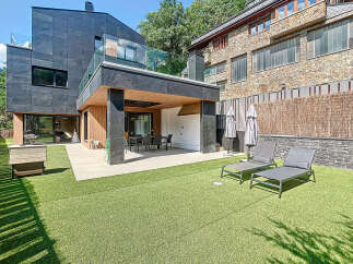 Discover modern luxury in this stunning property featuring sleek architecture and a beautifully landscaped outdoor space.