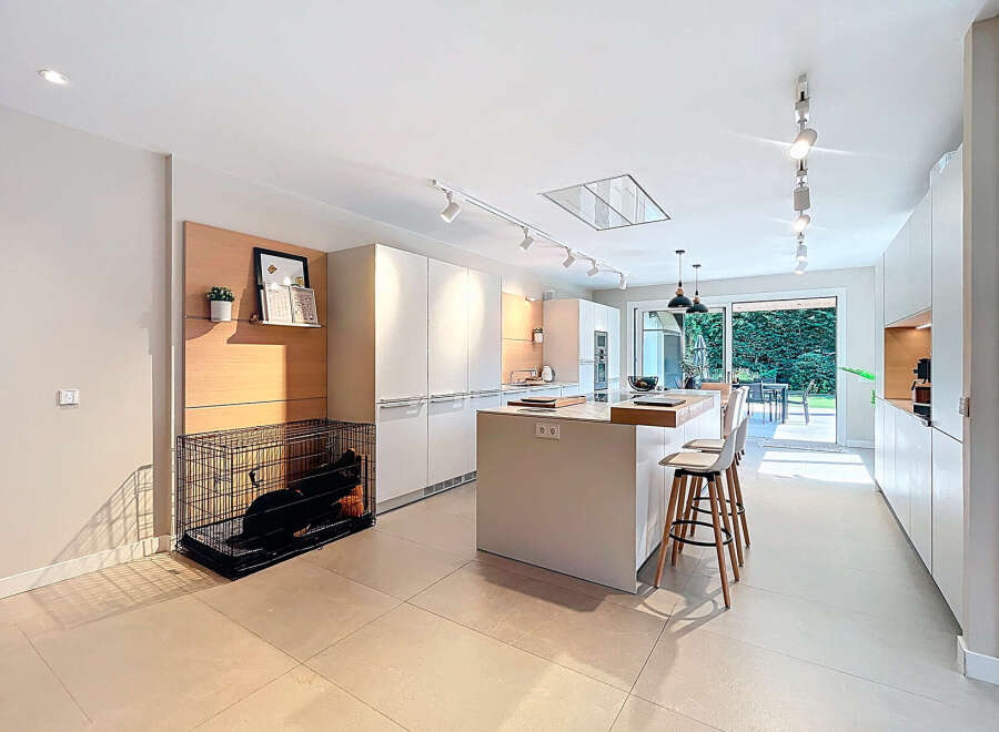 Modern kitchen design with sleek white cabinetry and a spacious island.