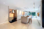 Modern kitchen design with sleek white cabinetry and a spacious island.