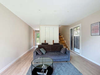 Discover a modern living space with a stylish sofa and a chic coffee table.