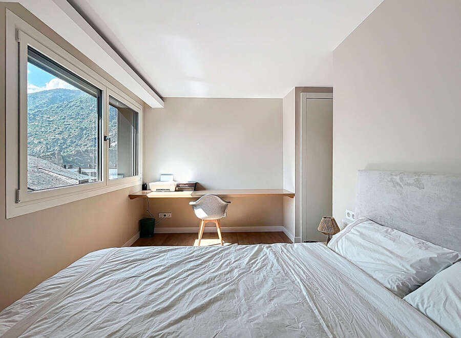 Discover a serene bedroom retreat with stunning mountain views.