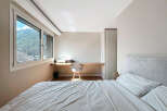 Discover a serene bedroom retreat with stunning mountain views.