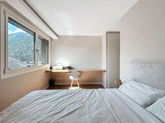 Discover a serene bedroom retreat with stunning mountain views.