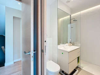 Step into a modern oasis with this stunning bathroom.