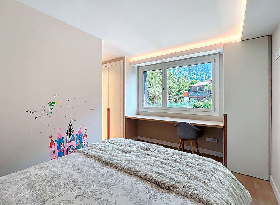 Discover a cozy bedroom with a charming castle wall decal, perfect for a child's space.