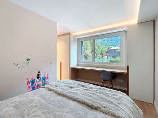 Discover a cozy bedroom with a charming castle wall decal, perfect for a child's space.
