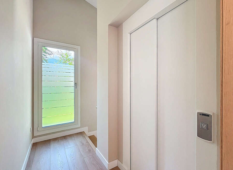 Discover a modern interior with a sleek elevator, perfect for easy access.