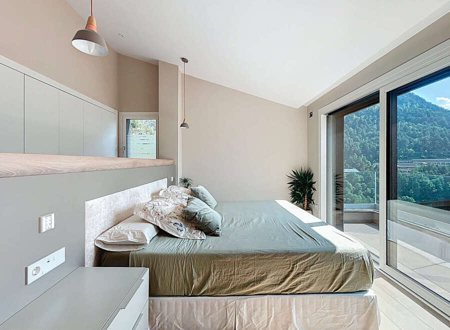 Discover a serene bedroom retreat with stunning mountain views.