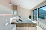 Discover a serene bedroom retreat with stunning mountain views.