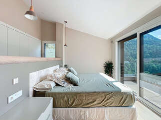 Discover a serene bedroom retreat with stunning mountain views.
