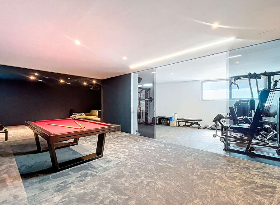 This luxurious property boasts a stunning game room with a pool table, perfect for entertaining.