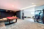 This luxurious property boasts a stunning game room with a pool table, perfect for entertaining.