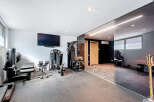 Step into your dream home gym! This space boasts state-of-the-art equipment, perfect for all your fitness needs.