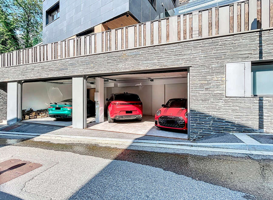 Discover modern luxury in this stunning property featuring a multi-car garage.