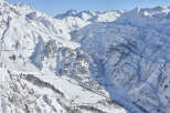 Experience the breathtaking beauty of the snow-covered mountains.