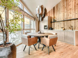This stunning property boasts a modern kitchen and dining area, perfect for entertaining.
