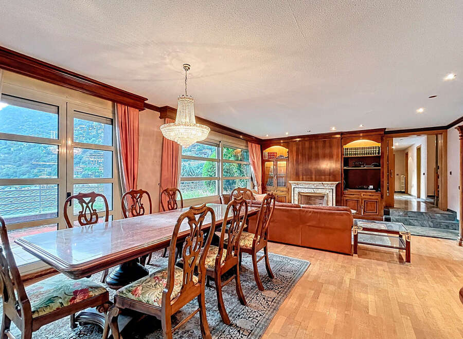 Elegant dining room with a stunning chandelier and a large dining table, perfect for hosting gatherings.