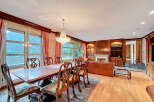 Elegant dining room with a stunning chandelier and a large dining table, perfect for hosting gatherings.