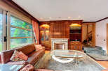 Elegant living room with a cozy fireplace and built-in bookshelves.