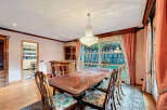 Elegant dining room featuring a stunning crystal chandelier, perfect for hosting memorable gatherings.