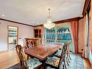 Elegant dining room featuring a stunning crystal chandelier, perfect for hosting memorable gatherings.