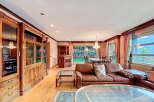 Elegant living space featuring a luxurious leather sofa and a stunning glass coffee table.