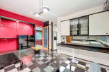 Step into a stunning kitchen with a unique black and white checkered floor.