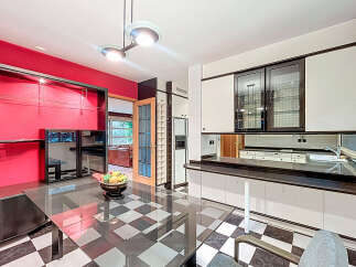 Step into a stunning kitchen with a unique black and white checkered floor.