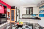 Step into this stunning kitchen, featuring a sleek black and white checkered floor that adds a touch of modern elegance.
