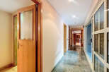 Explore this stunning property featuring a bright and airy hallway with elegant marble flooring.