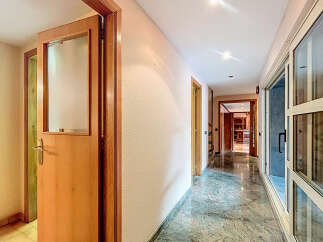 Explore this stunning property featuring a bright and airy hallway with elegant marble flooring.